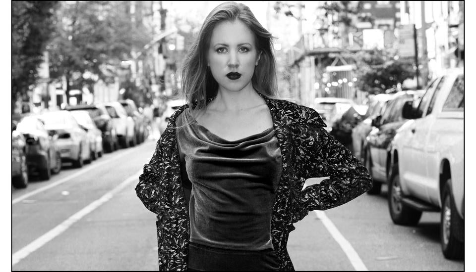 girl in velvet outfit in street